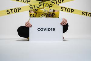 person-holding-covid-sign-3951600_s.jpg